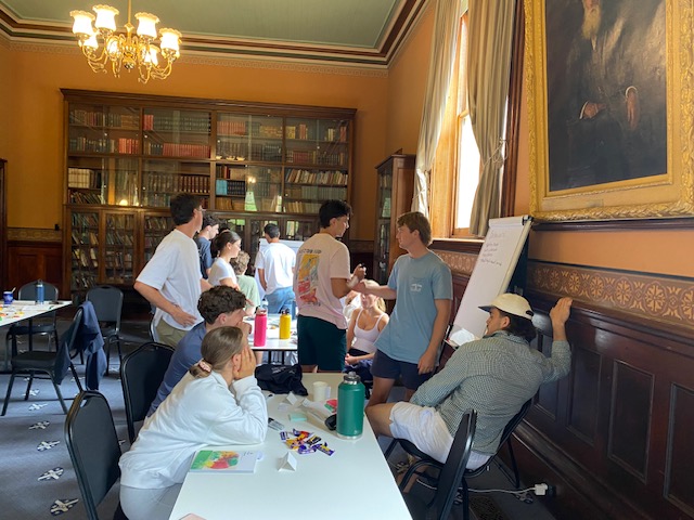 Participants working together at a flip chart during MHFA training