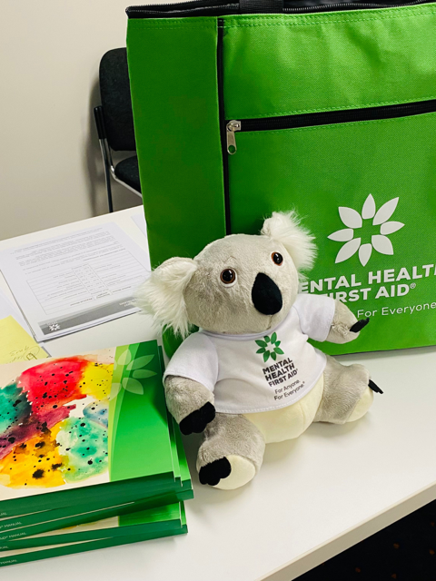 Mental Health First Aid training kit with manuals and koala mascot